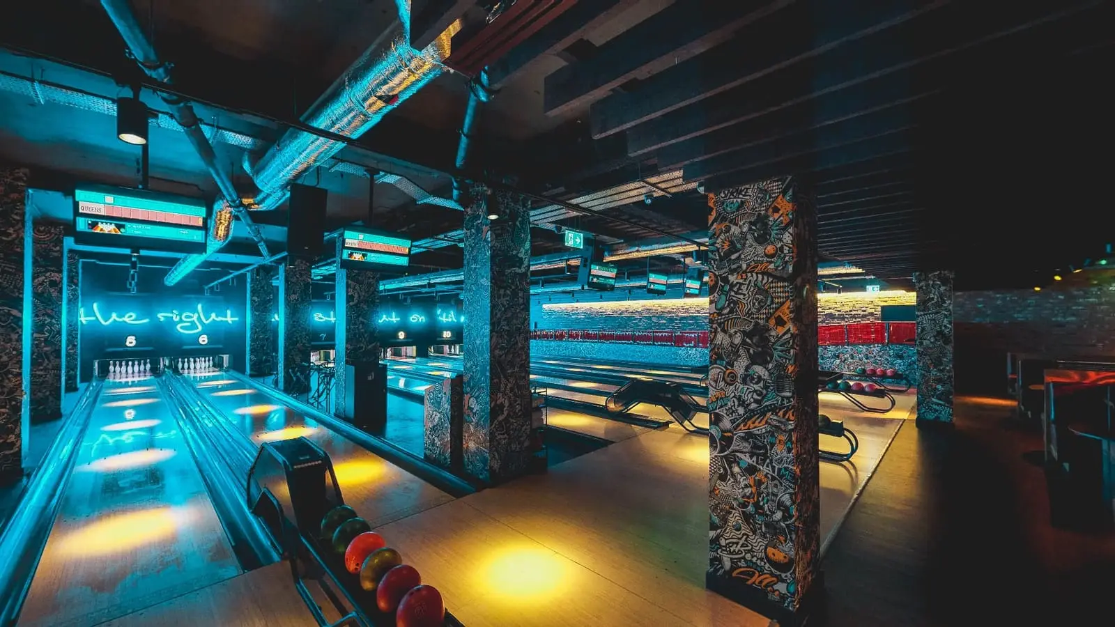 Modern bowling leisure facility with vibrant lighting and custom interior design